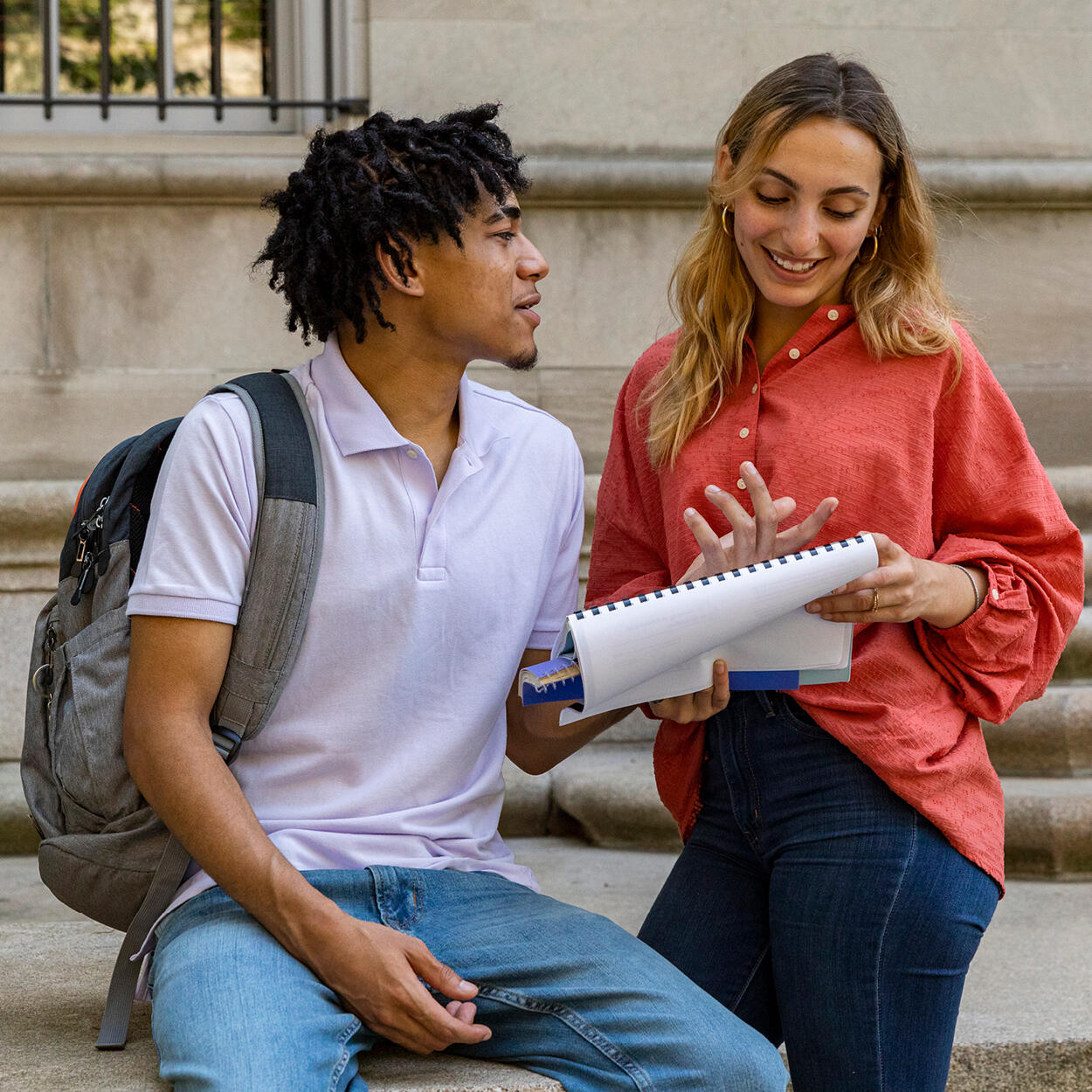 Two students reviewing notes